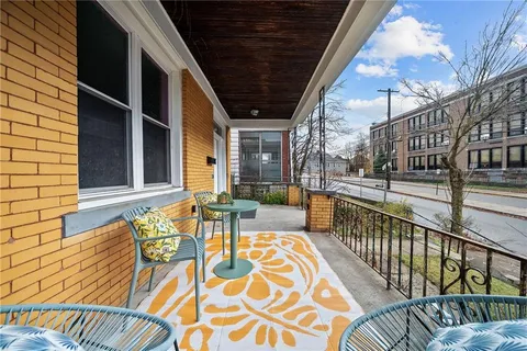 a view of a balcony with chairs