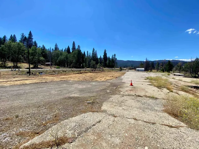 a view of road with trees in background