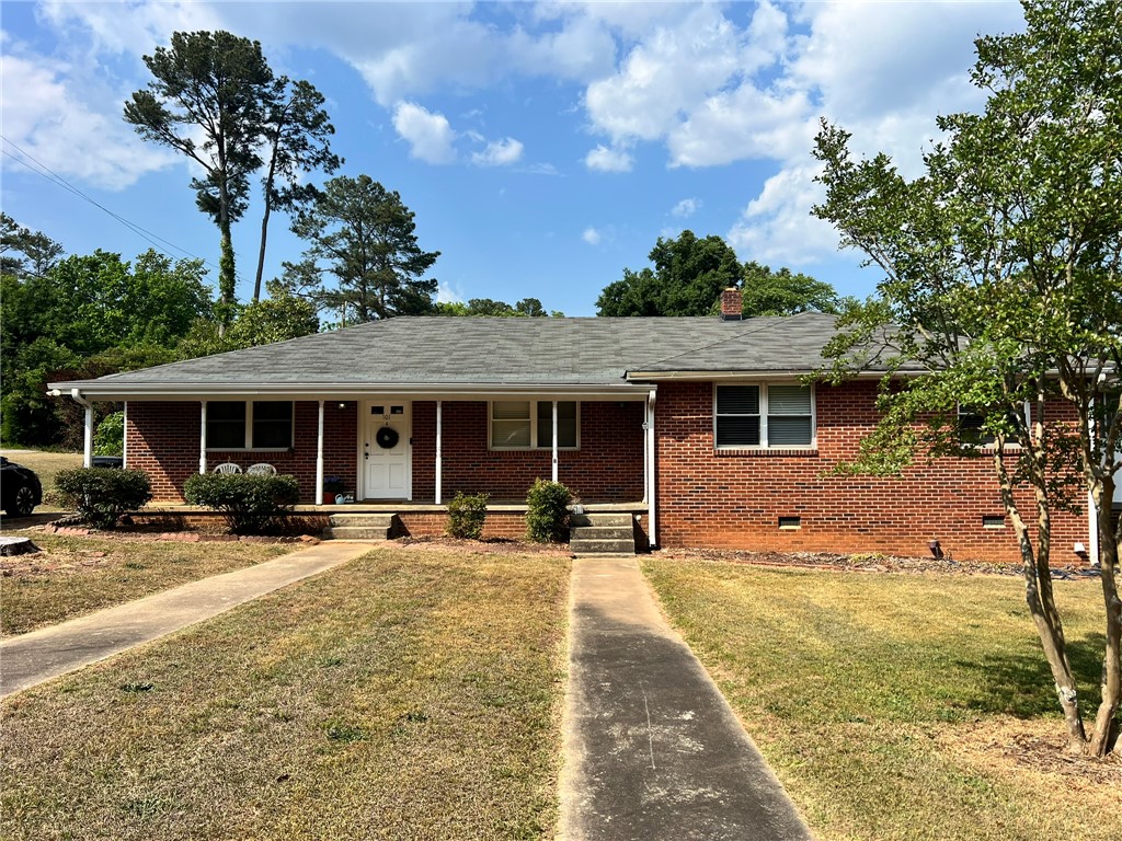 101 Clinton Drive, Unit B Anderson, SC 29621 - Photo 2 of 18 This classic brick residence features a welcoming covered porch, ideal for enjoying peaceful moments outdoors.