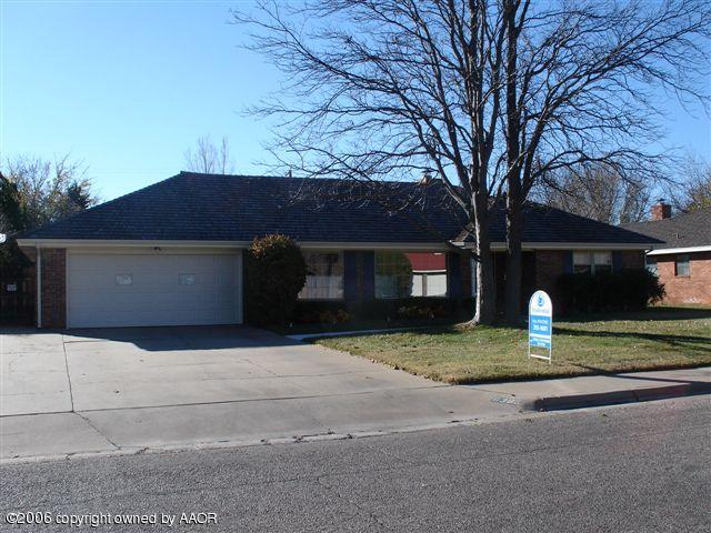 6303 Gainsborough Road Amarillo, TX 79106 - Photo 1 of 12 a front view of a house with a yard