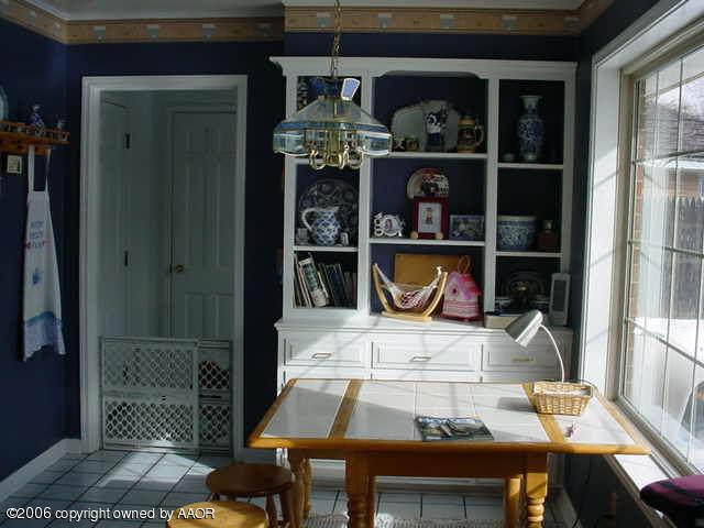 6303 Gainsborough Road Amarillo, TX 79106 - Photo 7 of 12 a dining room with furniture and window