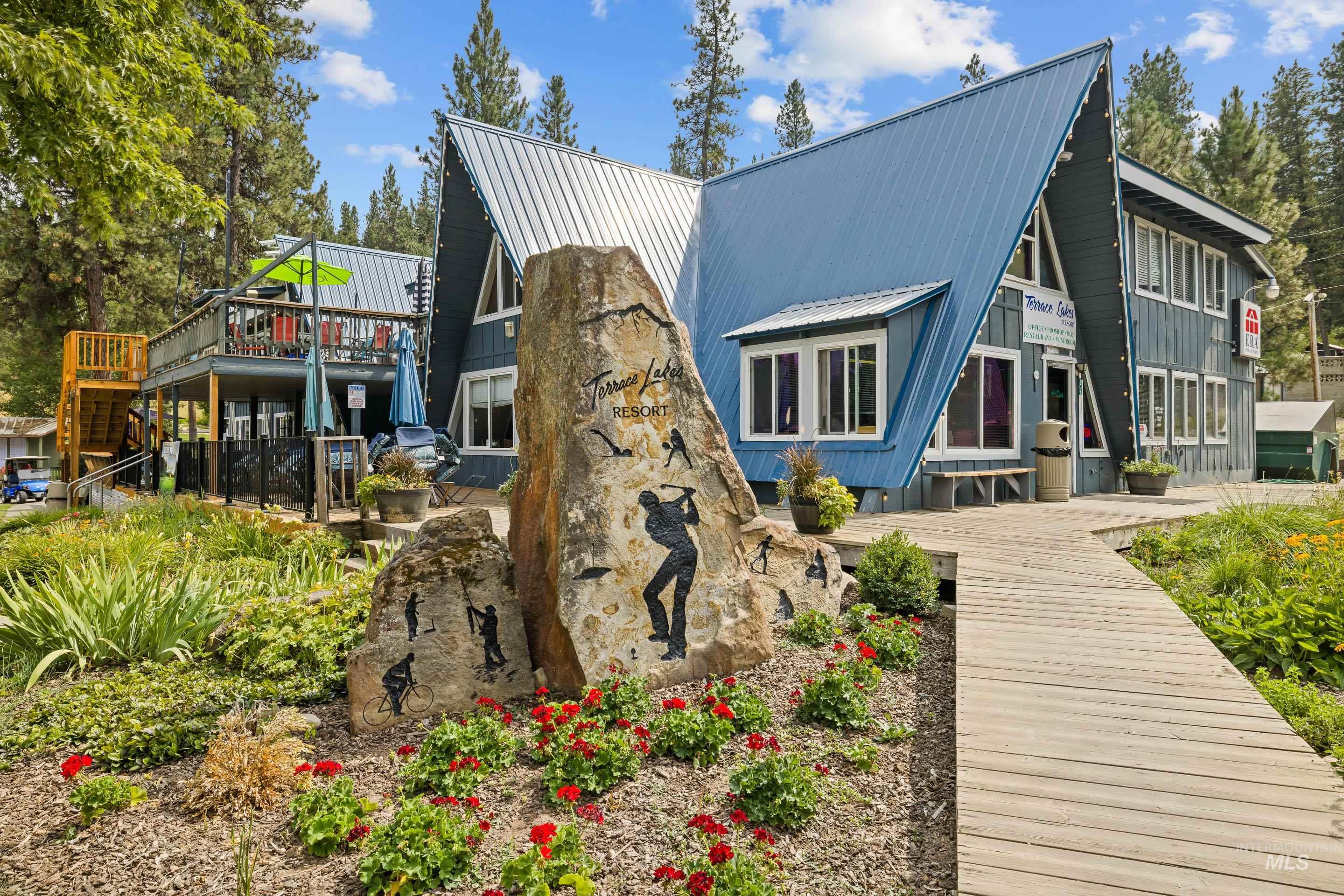 73 Rainbow Ridge Road Garden Valley, ID 83622 - Photo 46 of 49 A-frame architectural style with a blue metal roof and complementary siding