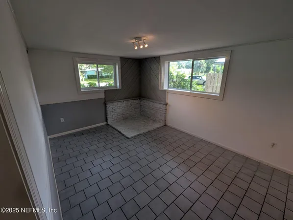 an empty room with windows