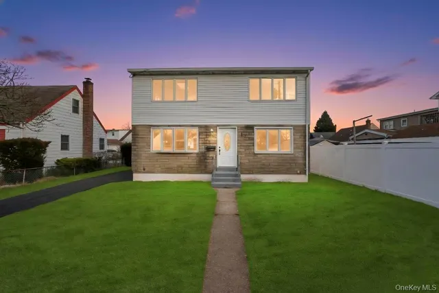 a front view of a house with yard