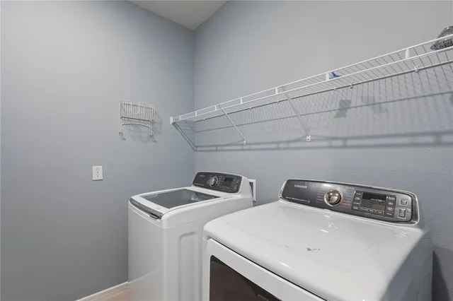 a utility room with dryer and washer