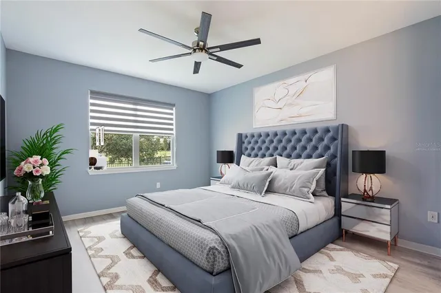 a bedroom with a bed potted plant and a window