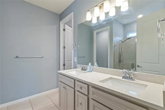 a bathroom with a sink a vanity and a mirror