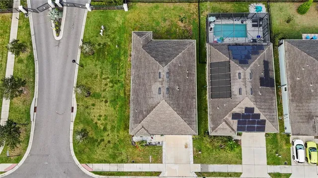 an aerial view of houses with outdoor space