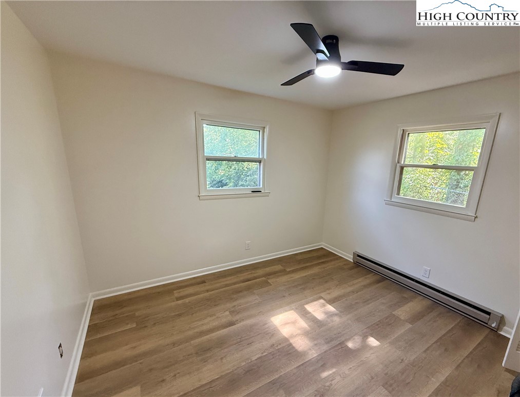 130 Maple Drive Boone, NC 28607 - Photo 15 of 21 wooden floor in an empty room with a window