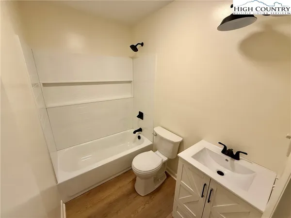 a bathroom with a sink a toilet and a bathtub