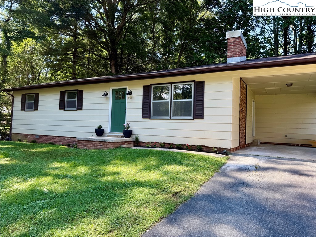 130 Maple Drive Boone, NC 28607 - Photo 2 of 21 a view of a house with backyard