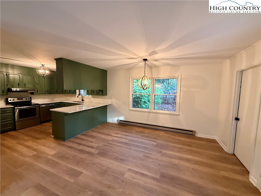 130 Maple Drive Boone, NC 28607 - Photo 5 of 21 a kitchen with a sink and a stove top oven