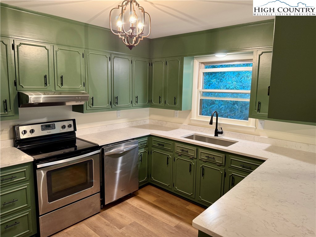 130 Maple Drive Boone, NC 28607 - Photo 6 of 21 a kitchen with stainless steel appliances granite countertop a sink and cabinets