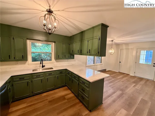 a large spacious bathroom with a large tub and sink