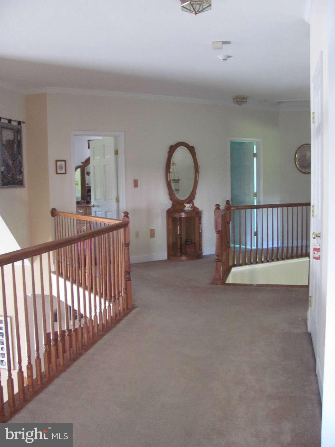 7000 Old Solomons Island Road Friendship, MD 20758 - Photo 14 of 30 Upstairs open hall and balcony