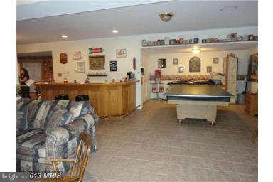 7000 Old Solomons Island Road Friendship, MD 20758 - Photo 24 of 30 Wet bar and game area in basement