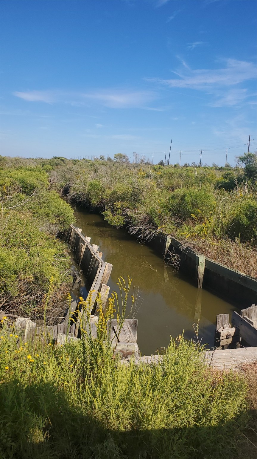 1072 4th Street Port Bolivar, TX 77650 - Photo 2 of 3 an aerial view of residential houses with outdoor space and lake view
