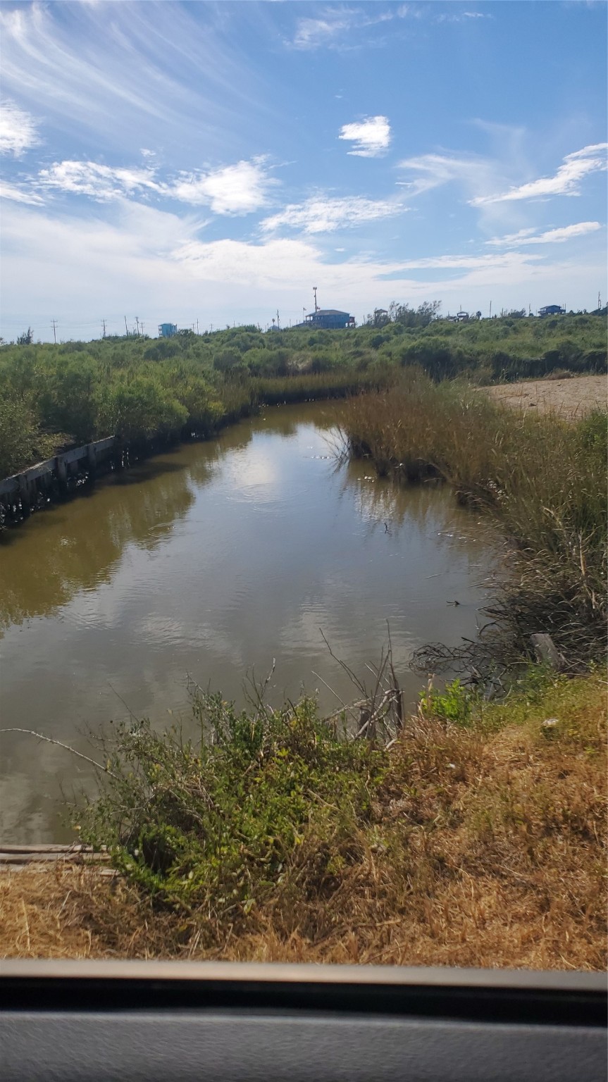 1072 4th Street Port Bolivar, TX 77650 - Photo 3 of 3 a view of a lake with a city