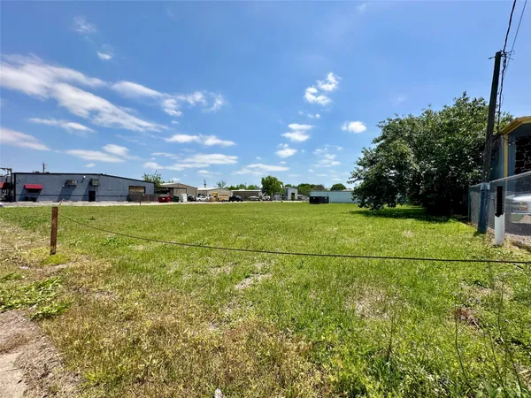 a view of a golf course with a big yard