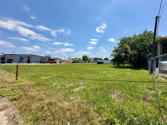 a view of a golf course with a big yard