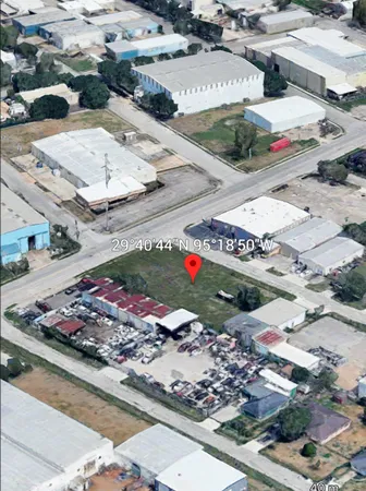 an aerial view of residential house with parking