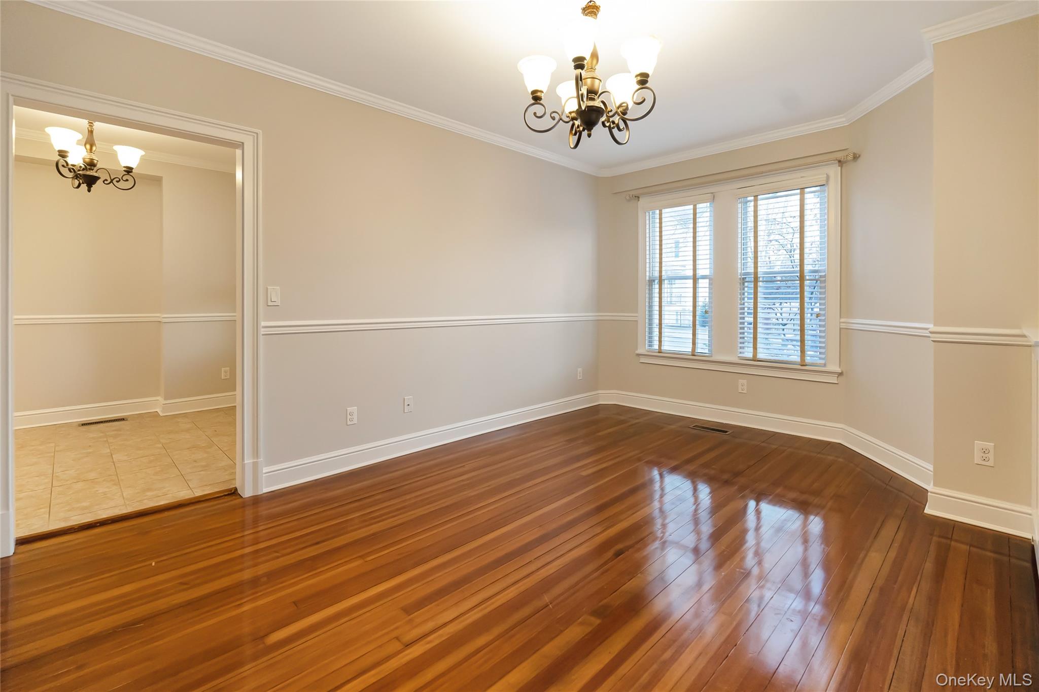 147 Beekman Avenue, Unit 1 Sleepy Hollow, NY 10591 - Photo 4 of 22 wooden floor in an empty room with a window