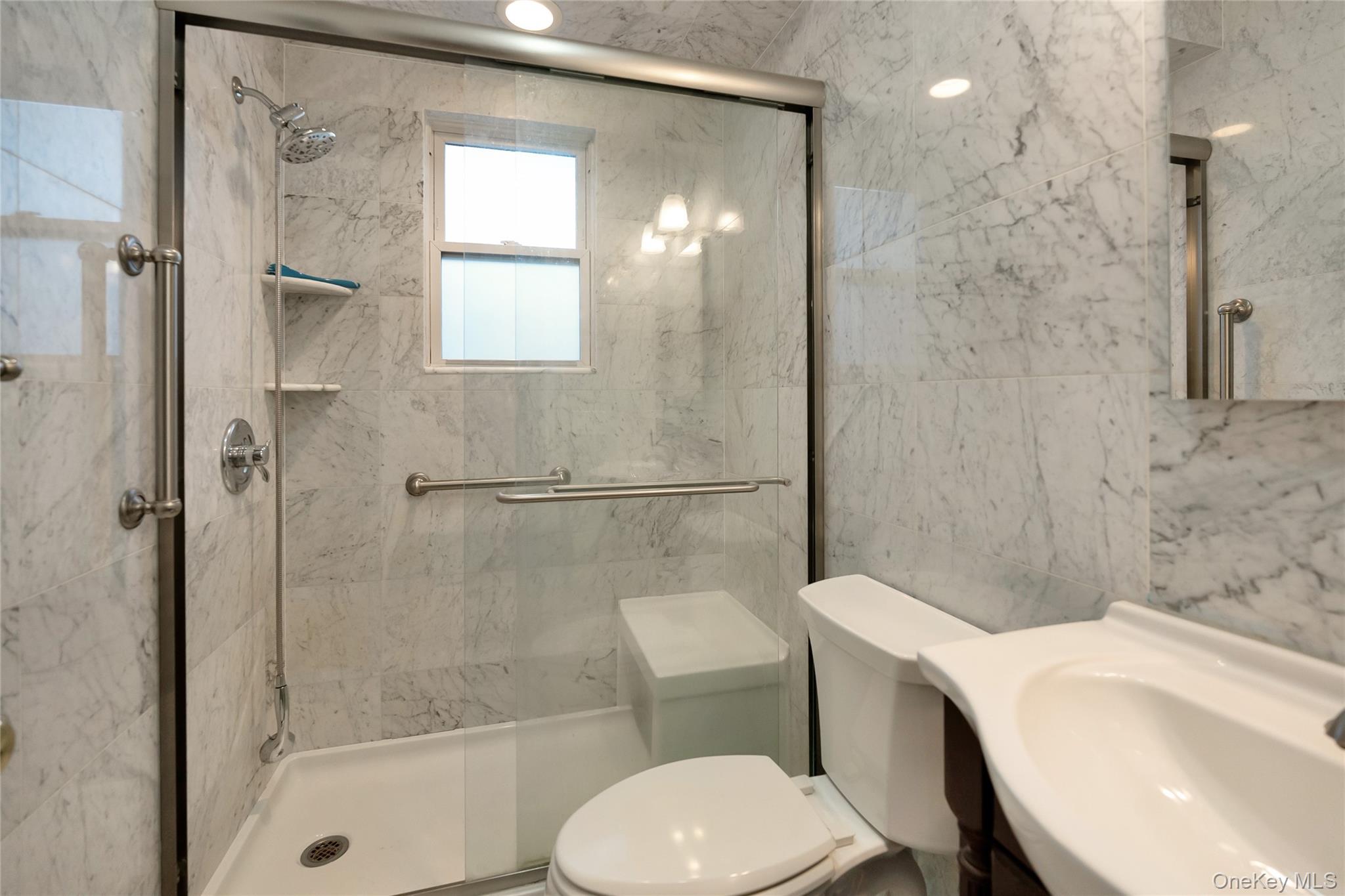 147 Beekman Avenue, Unit 1 Sleepy Hollow, NY 10591 - Photo 8 of 22 a bathroom with a sink toilet and shower