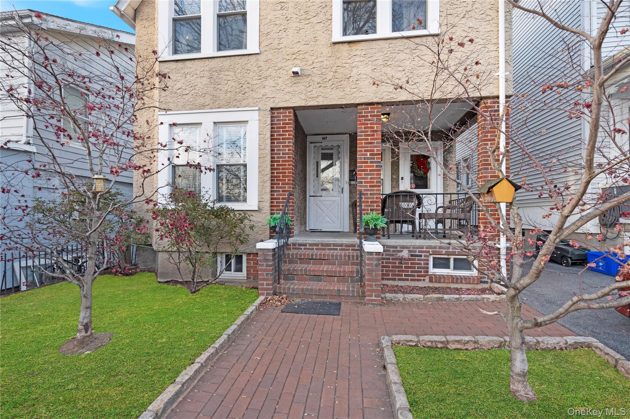 147 Beekman Avenue, Unit 1 Sleepy Hollow, NY 10591 - Photo 10 of 22 a front view of a building with garden