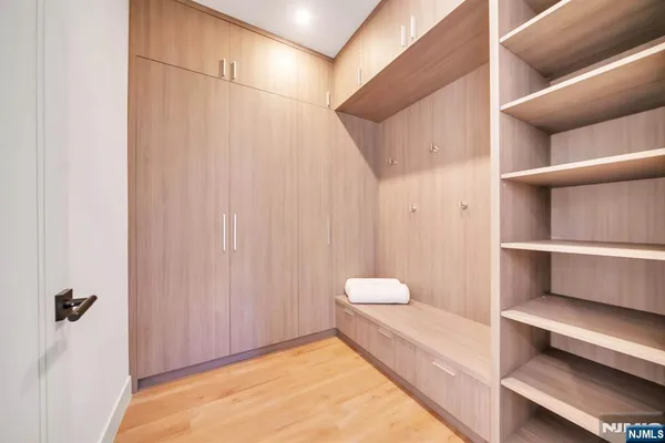 a bathroom with a granite countertop sink a toilet and a mirror