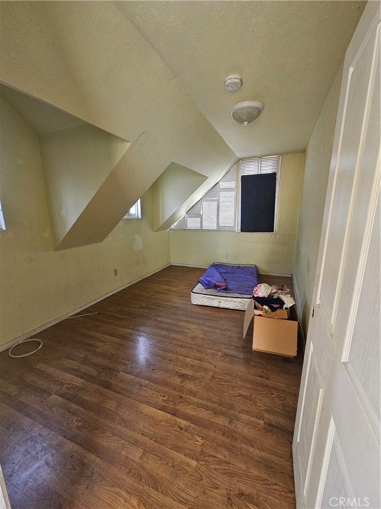 4276 Maxson Road El Monte, CA 91732 - Photo 14 of 17 a room with wooden floor and furniture