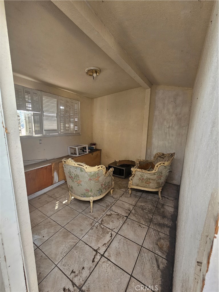 4276 Maxson Road El Monte, CA 91732 - Photo 15 of 17 a bed room with a couch and a window