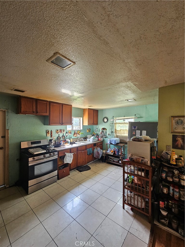 4276 Maxson Road El Monte, CA 91732 - Photo 2 of 17 a kitchen with stainless steel appliances lots of counter top space