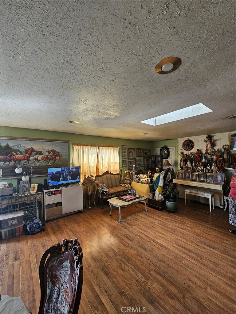 4276 Maxson Road El Monte, CA 91732 - Photo 5 of 17 a living room with furniture and a wooden floor
