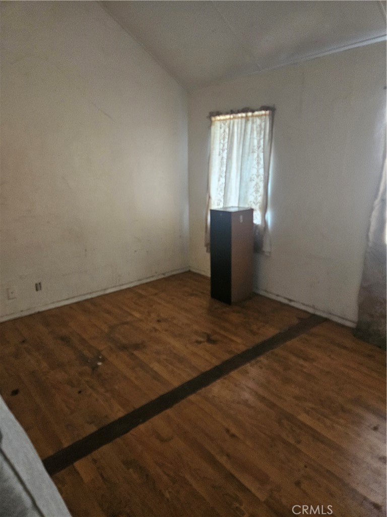 4276 Maxson Road El Monte, CA 91732 - Photo 6 of 17 an empty room with wooden floor windows and entrance