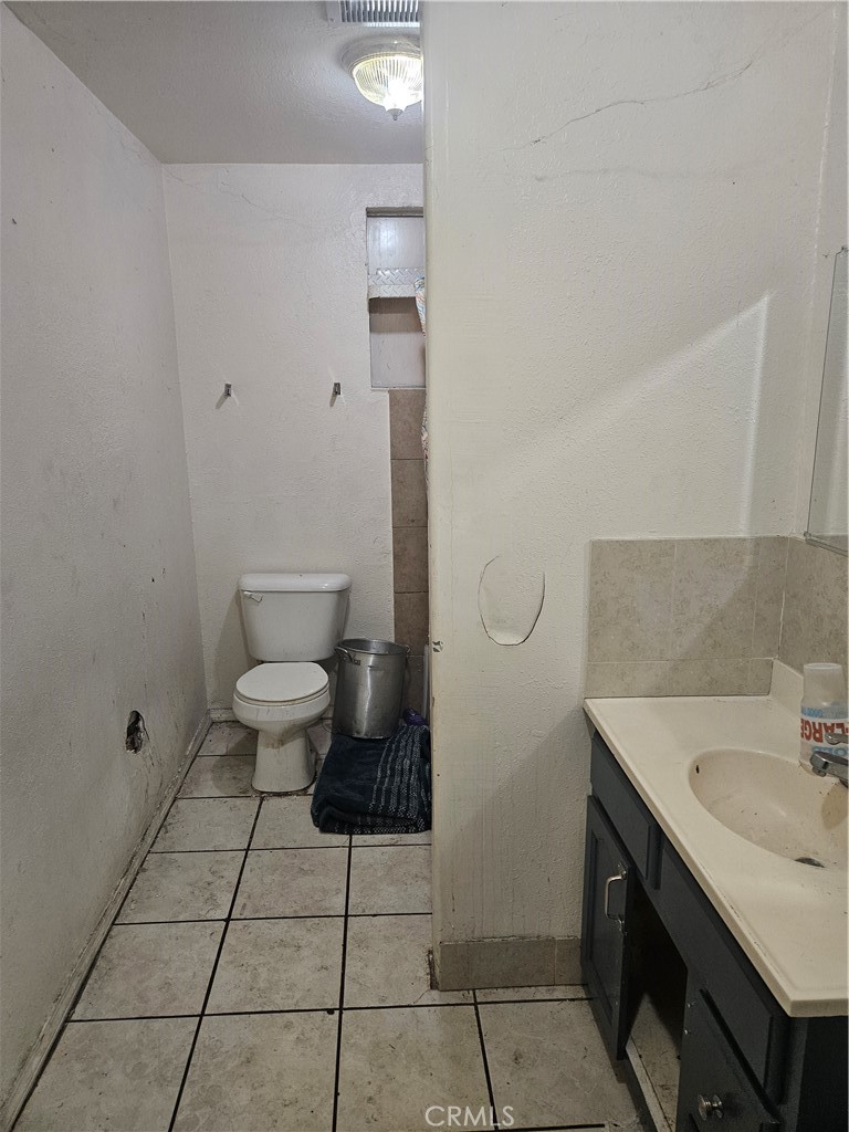 4276 Maxson Road El Monte, CA 91732 - Photo 7 of 17 a bathroom with a sink toilet and vanity