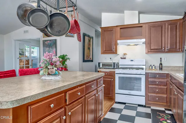 a kitchen with a sink cabinets and window