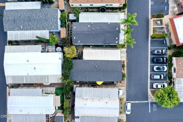 an aerial view of a house with a big yard