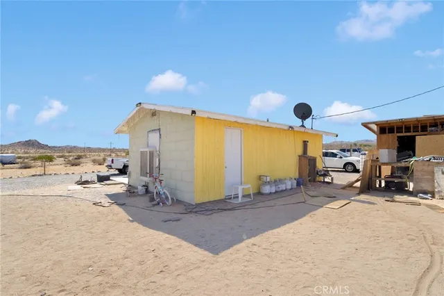 a view of a house with parking space