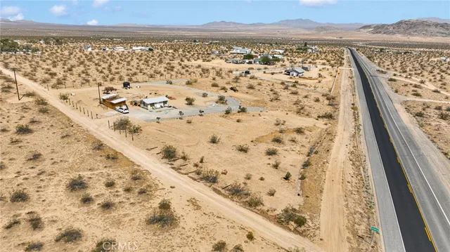 a view of wooden floor and a mountain view