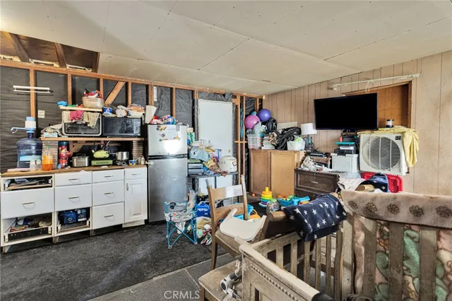 a view of a livingroom with furniture and a window