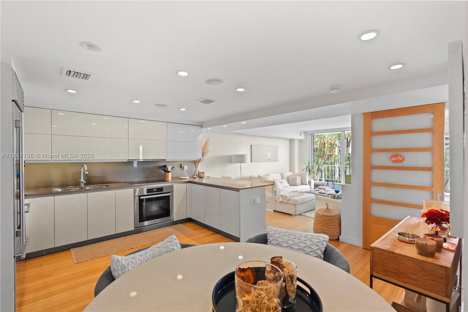 Brickell Miami, FL 33129 - Photo 13 of 44 a large kitchen with a large window and stainless steel appliances