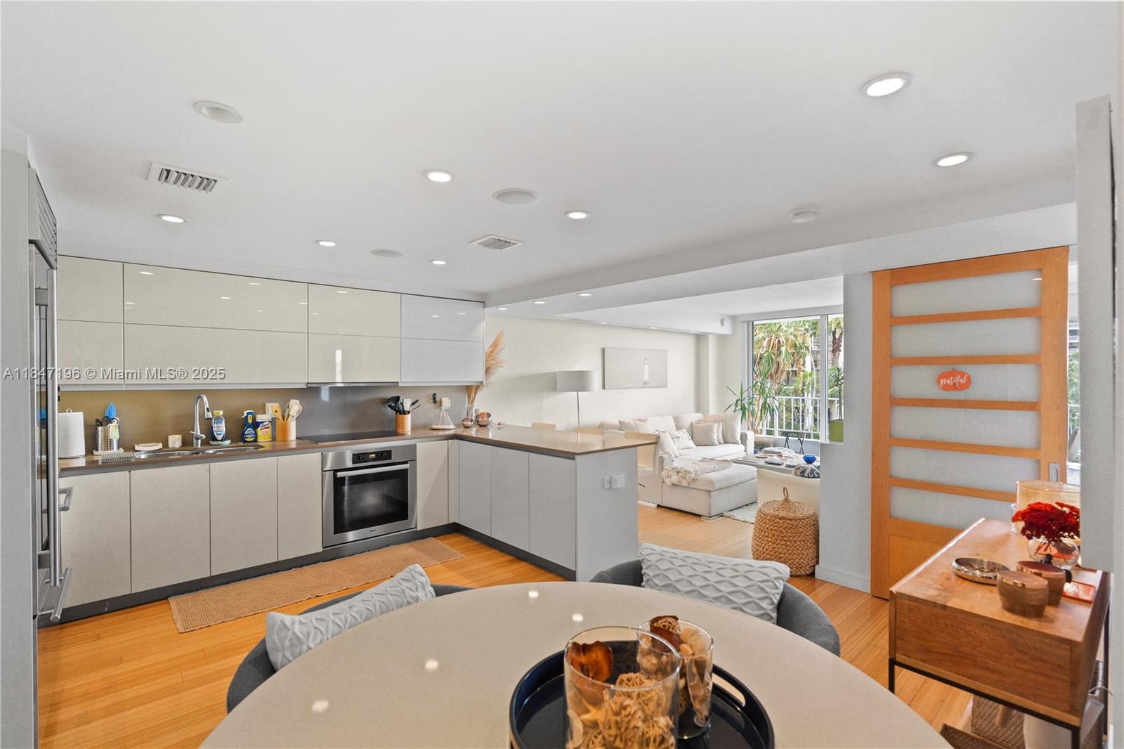 Brickell Miami, FL 33129 - Photo 14 of 44 a large kitchen with a large window and stainless steel appliances