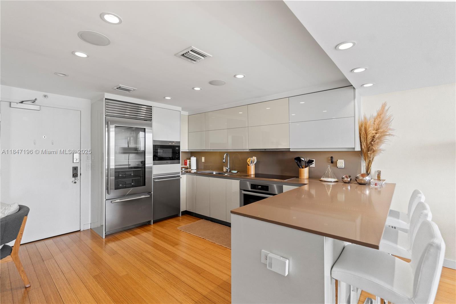 Brickell Miami, FL 33129 - Photo 16 of 44 a kitchen with a refrigerator a stove top oven and a sink