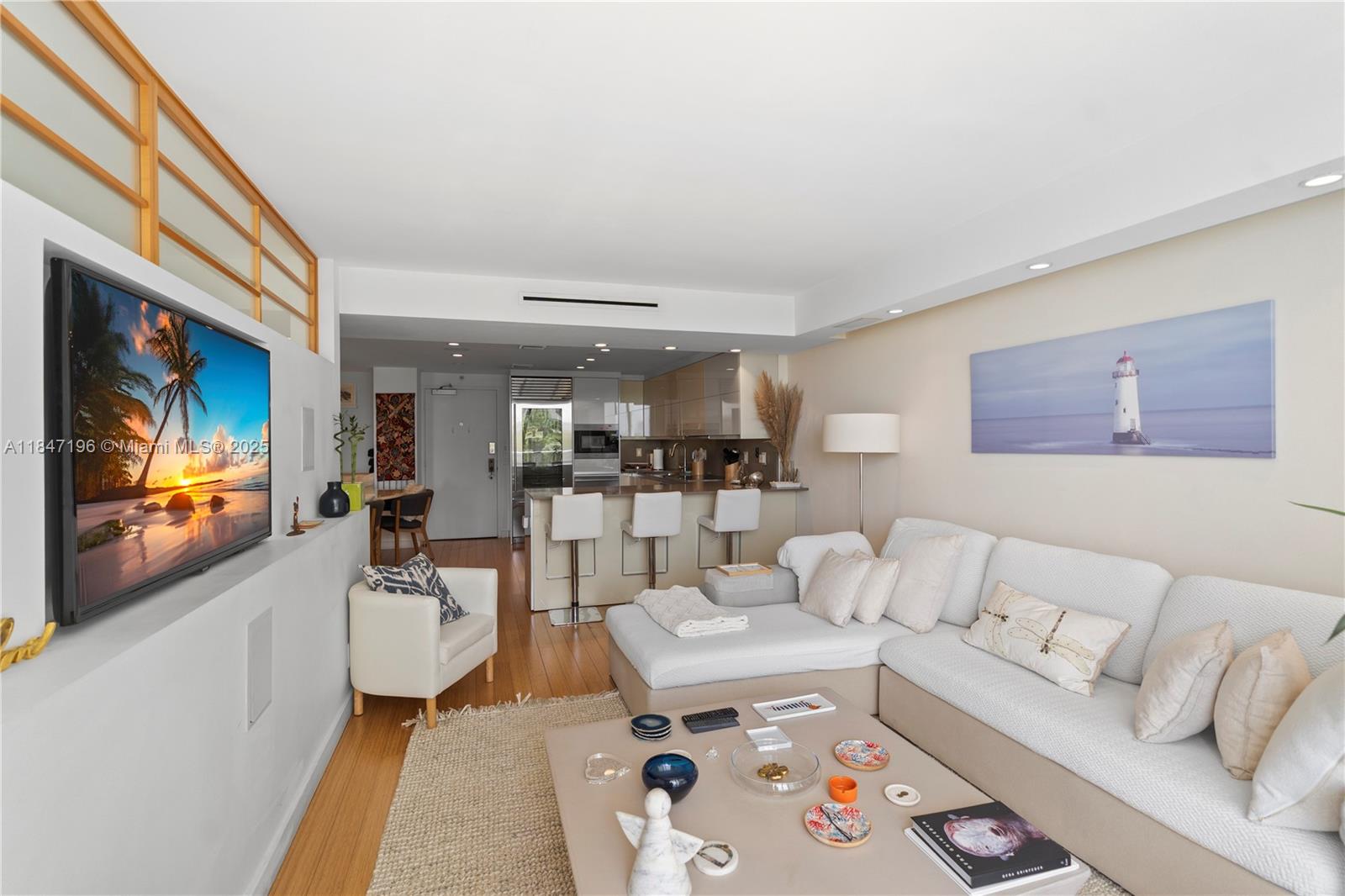 Brickell Miami, FL 33129 - Photo 19 of 44 a living room with furniture and a flat screen tv