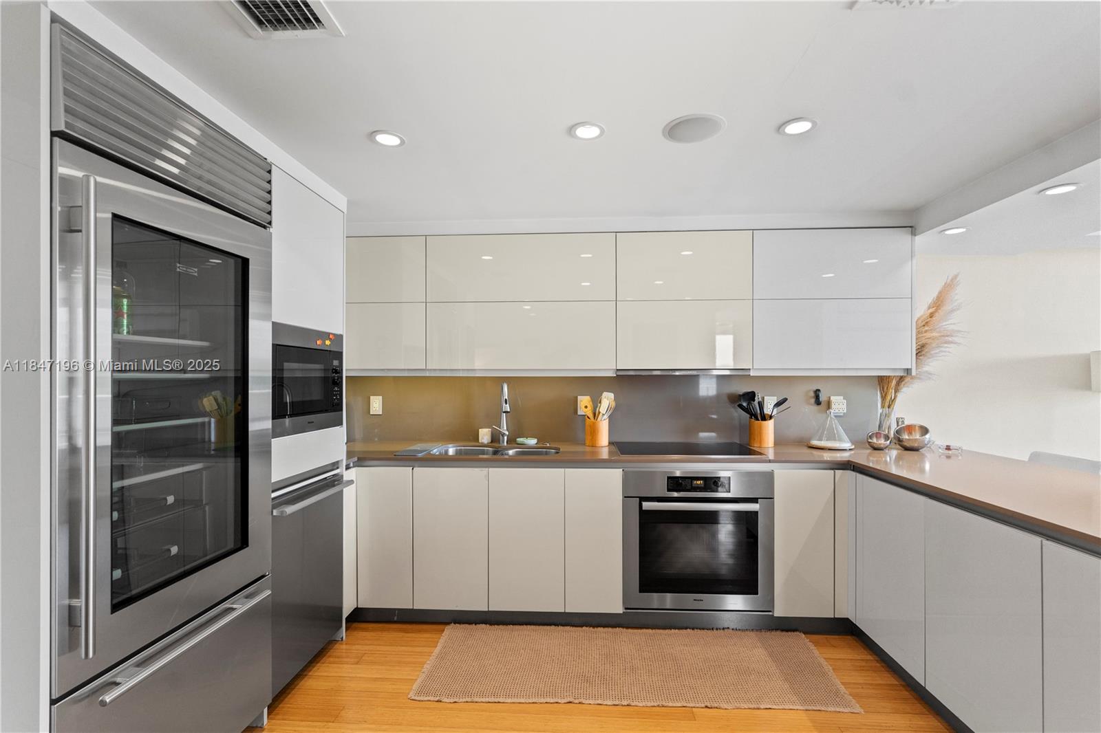Brickell Miami, FL 33129 - Photo 24 of 44 a kitchen with a sink stove and refrigerator