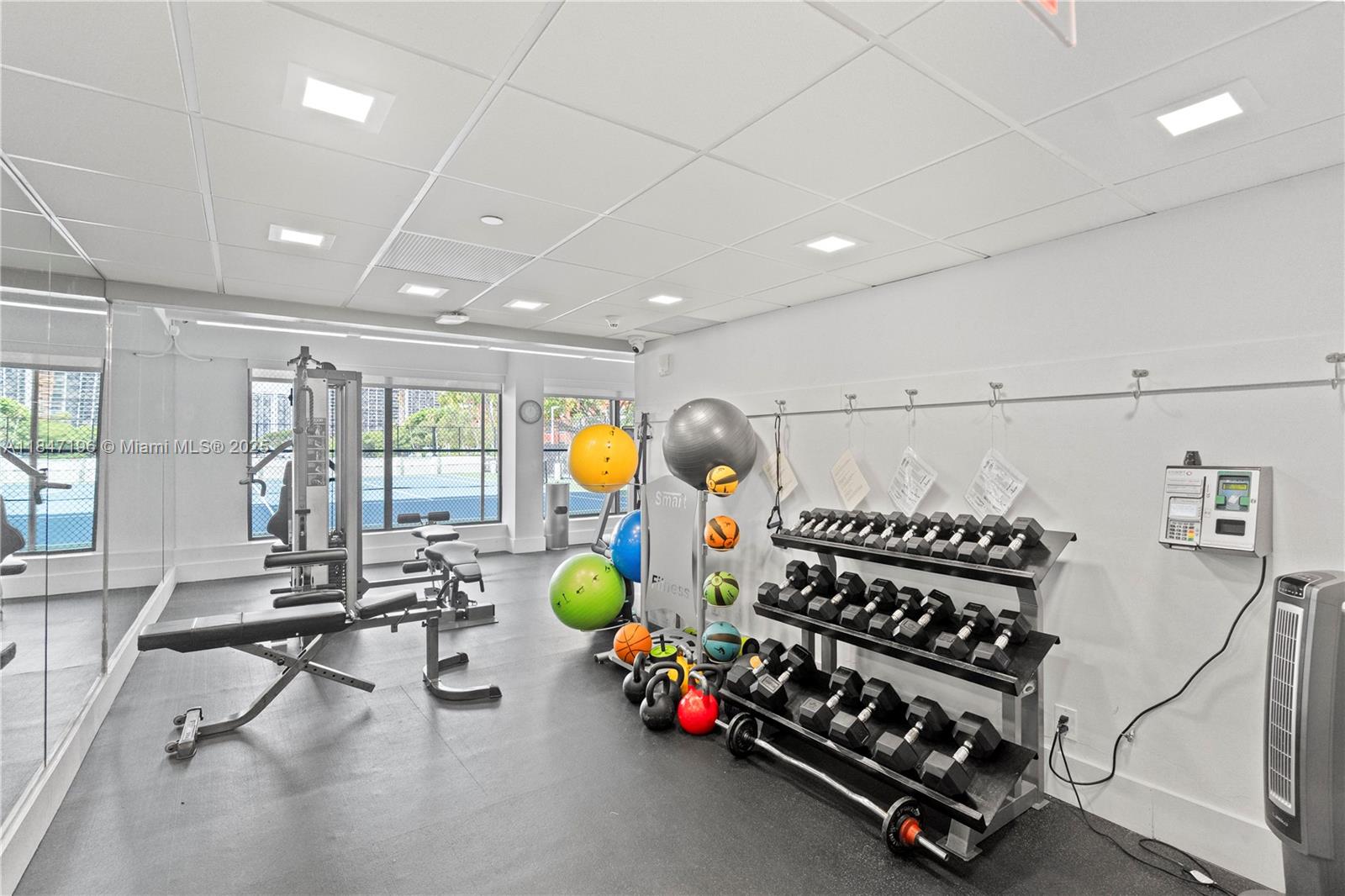 Brickell Miami, FL 33129 - Photo 43 of 44 a room with lots of gym equipment and windows
