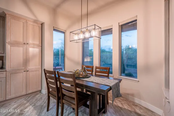 a open kitchen with granite countertop white cabinets and stainless steel appliances
