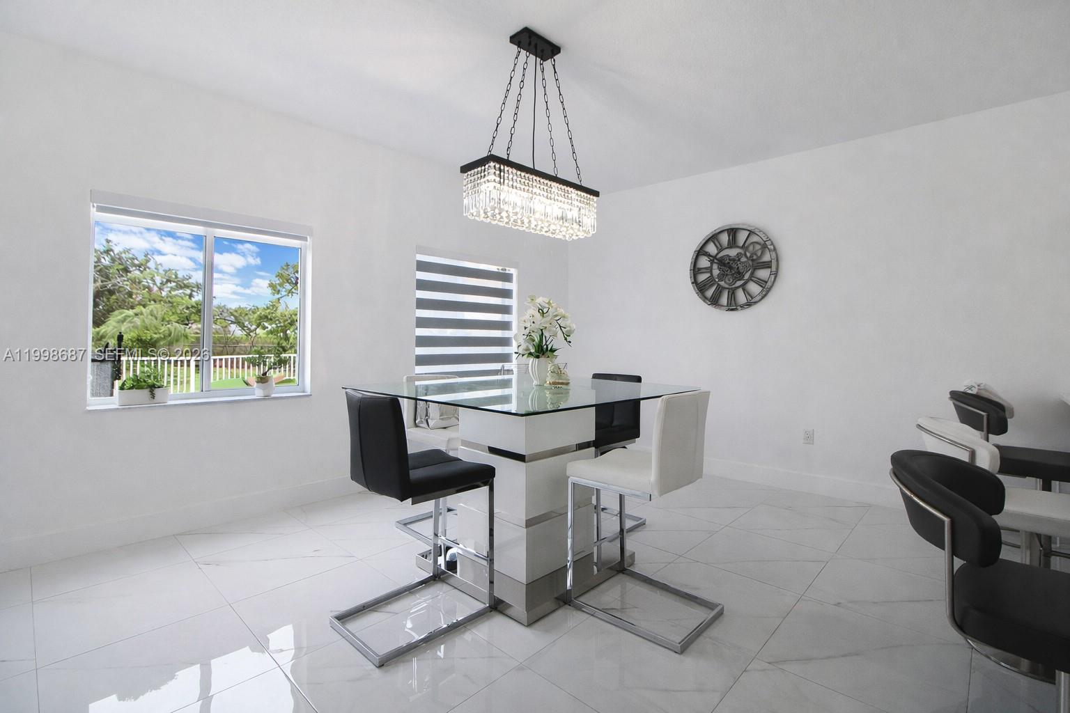 15045 Southwest 38th Terrace Miami, FL 33185 - Photo 17 of 37 a view of entryway and kitchen