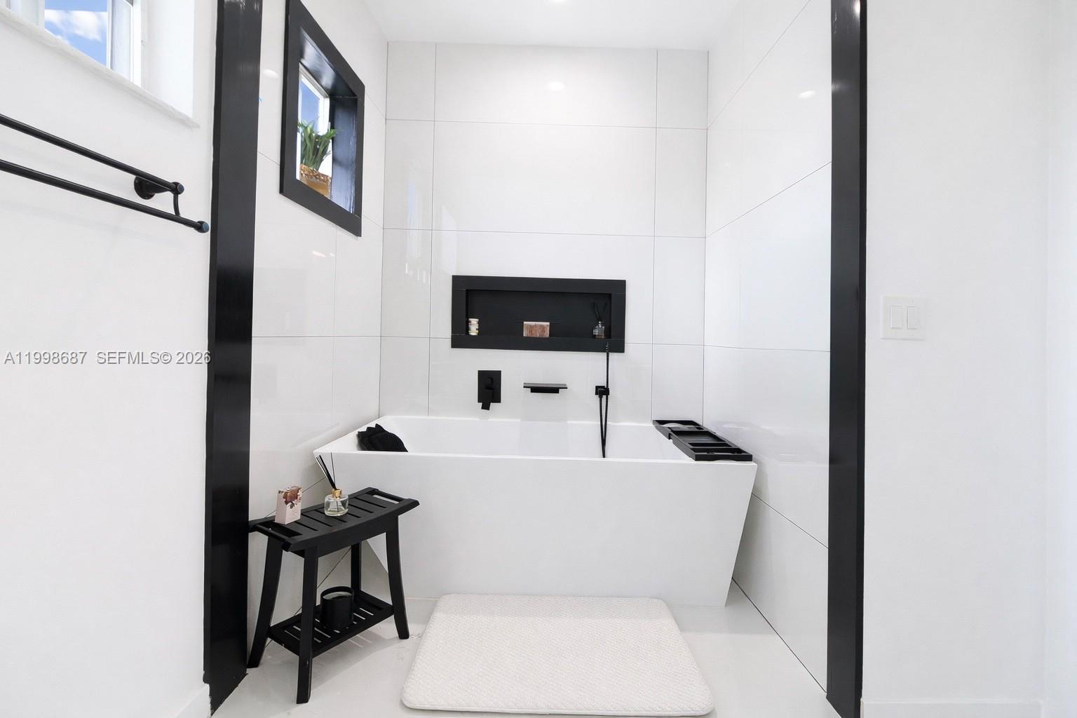15045 Southwest 38th Terrace Miami, FL 33185 - Photo 21 of 37 a white toilet sitting next to a bathroom sink