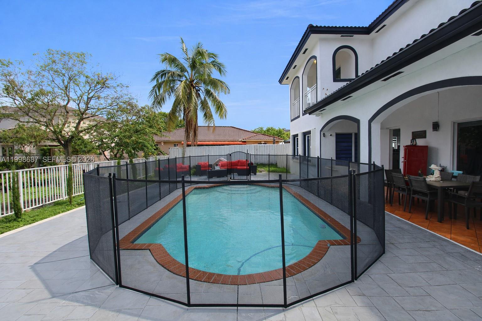15045 Southwest 38th Terrace Miami, FL 33185 - Photo 31 of 37 a view of roof deck with a barbeque and wooden fence